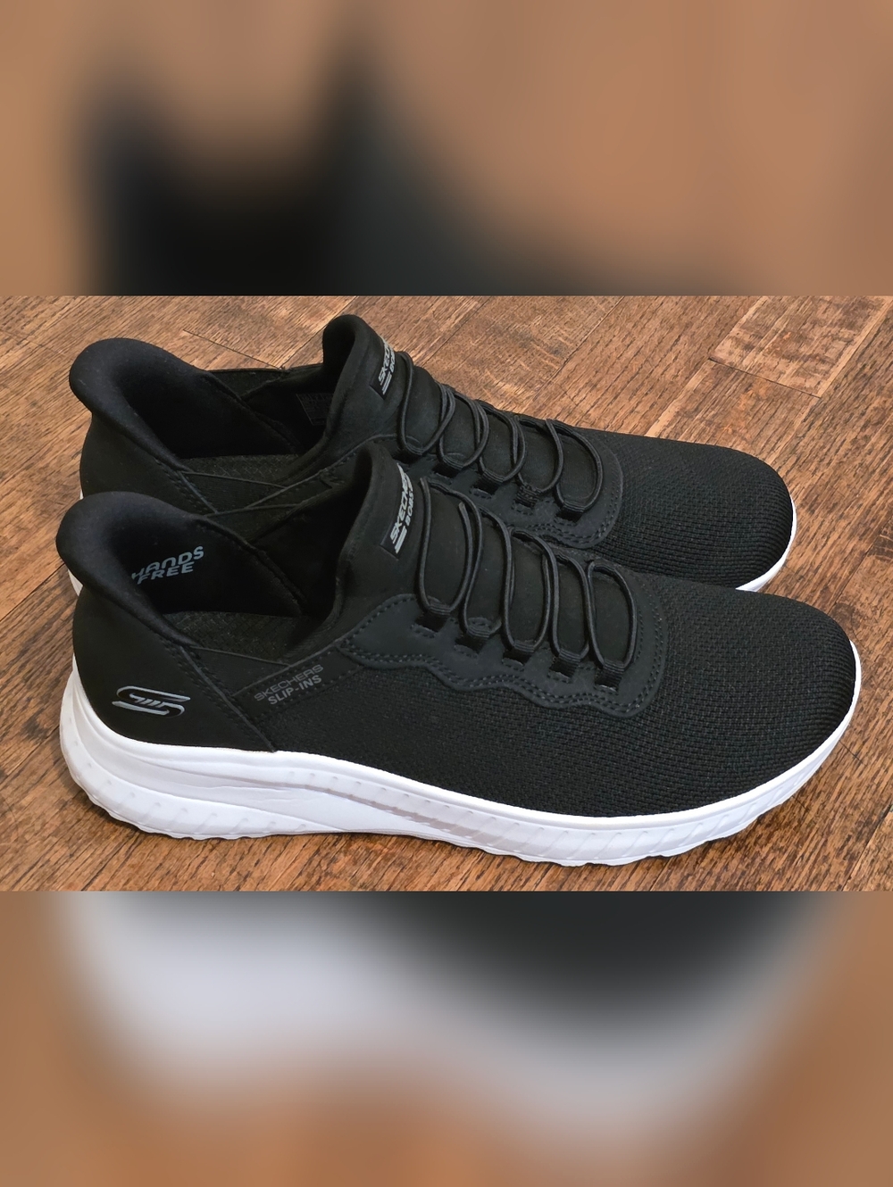 Skechers WOMENS Black Knit Slip-On Sneakers with White Sole
